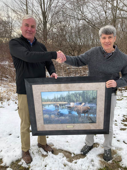 Scot Williamson, left, receiving the 2022 Robert McDowell Award for Conservation Management Excellence from NEAFWA President Mark Tisa (MA), right.